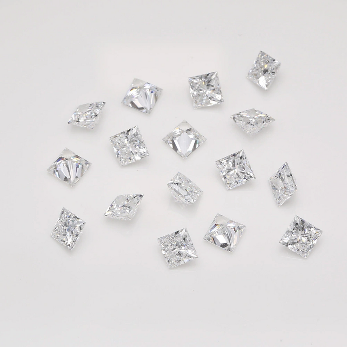 A bunch of princess-cut melee diamonds from different angles