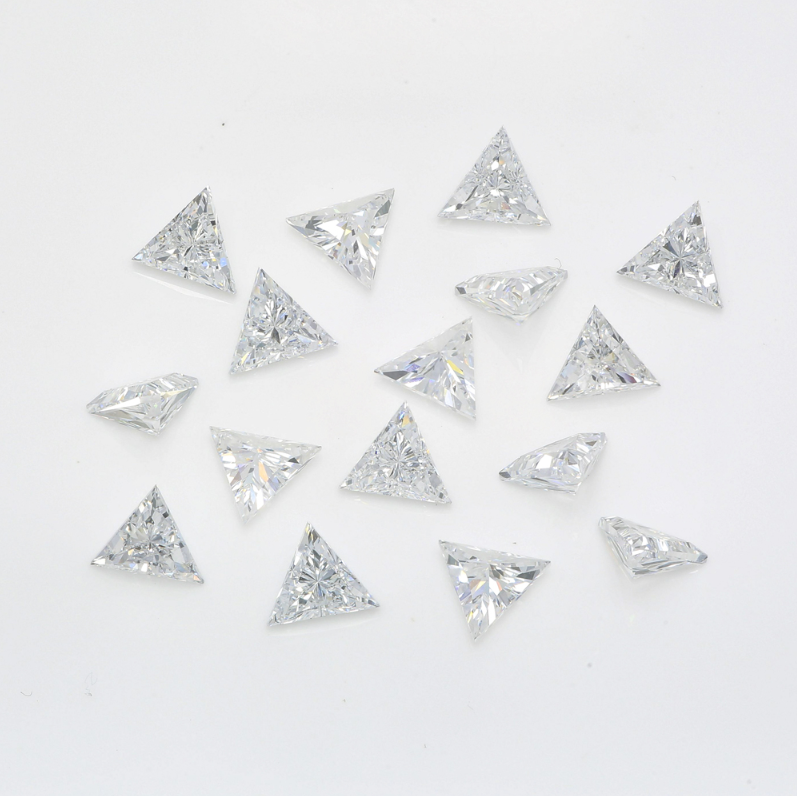 Carateu triangular lab-grown melee diamonds showcasing sparkling geometric gemstones on a white background.