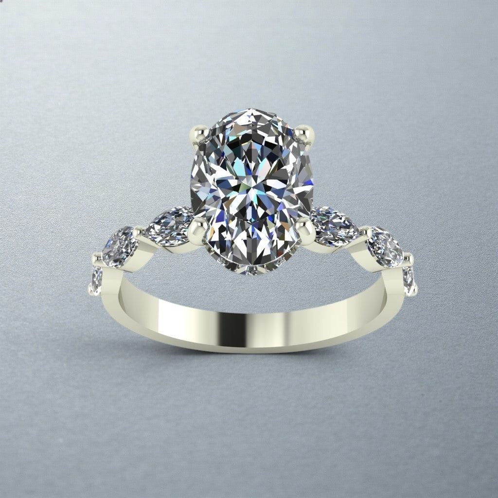 Carateu custom oval diamond ring with hidden halo and marquise band, showcasing intricate design and sparkling gemstones.