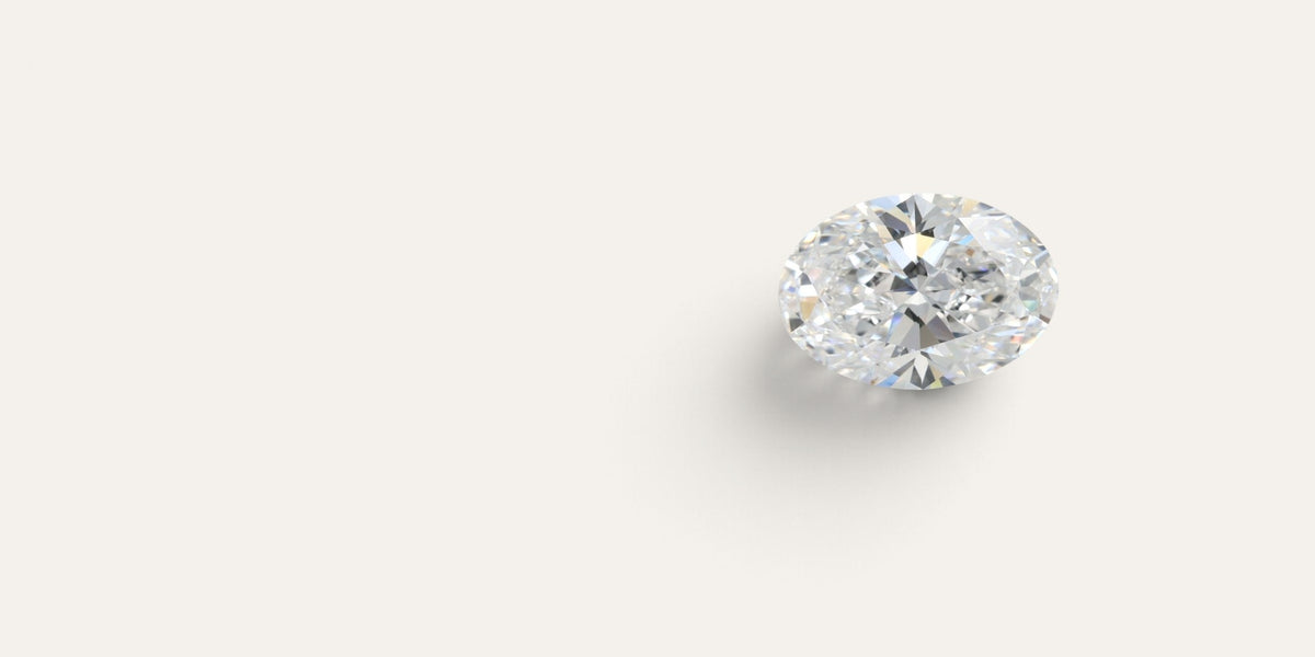 Oval lab-grown diamond on a warm ivory background