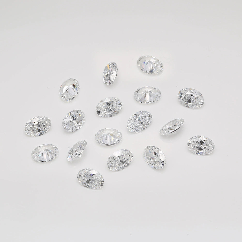 Oval natural melee diamonds from Carateu, showcasing sparkling small gemstones with oval cuts on a neutral background.